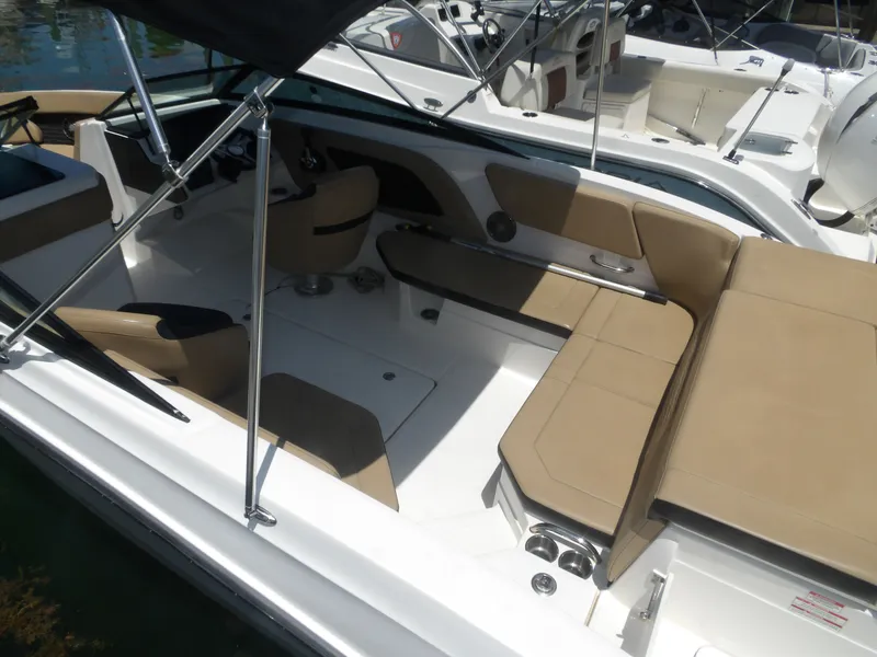 Slide: The Image of Interior of 2024 Sea Ray SPX 230 with beige seating. - 6