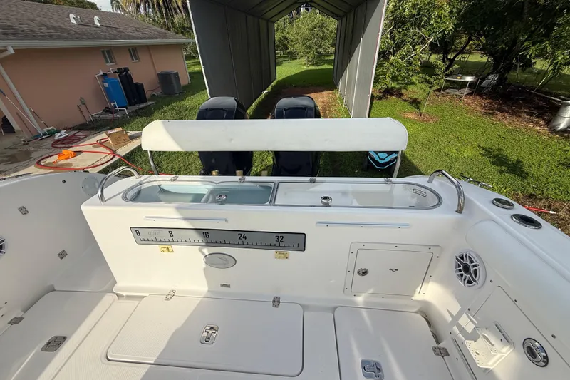 Slide: The Image of 2007 Century 3200 Center Console boat interior with fishing ruler and storage compartments. - 10