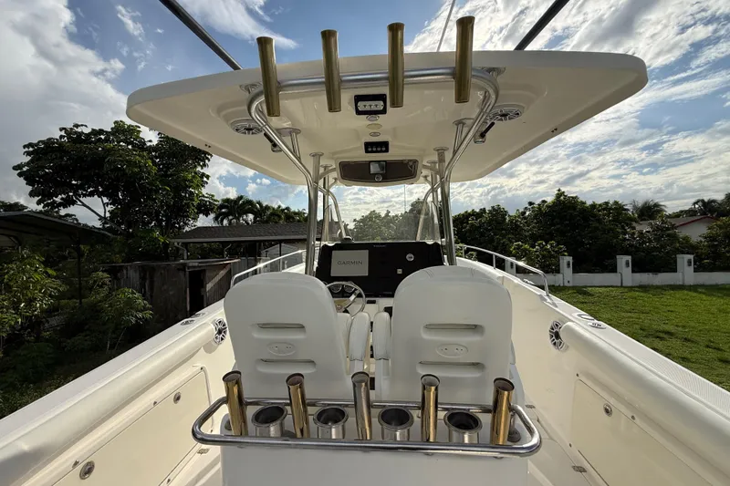Slide: The Image of 2007 Century 3200 Center Console boat interior with rod holders and navigation equipment. - 12