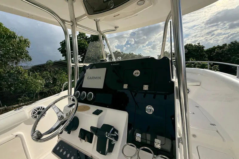 Slide: The Image of 2007 Century 3200 Center Console boat dashboard with Garmin navigation system. - 13