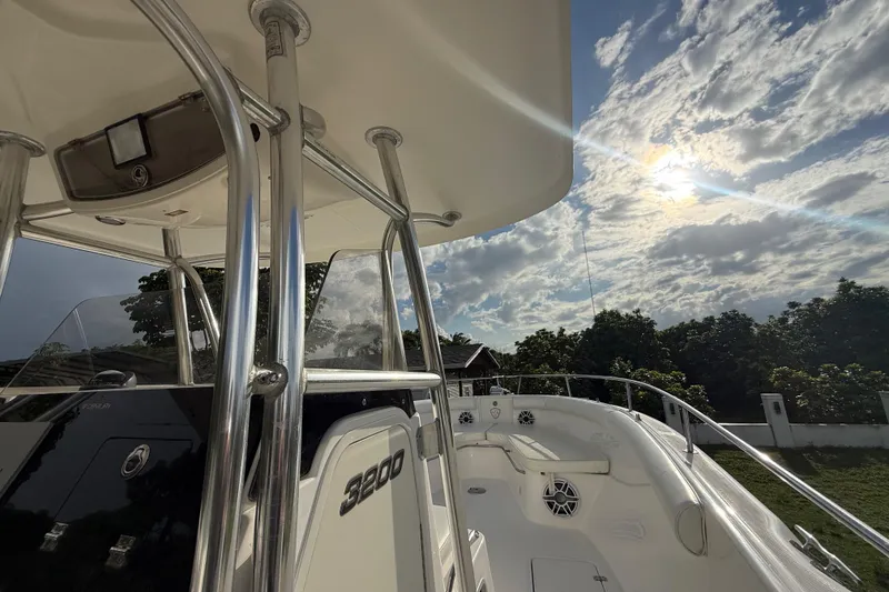Slide: The Image of 2007 Century 3200 Center Console boat under a partly cloudy sky. - 16