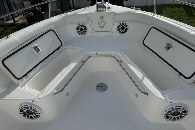 Slide: The Image of 2007 Century 3200 Center Console boat interior with storage compartments and speakers. - 19