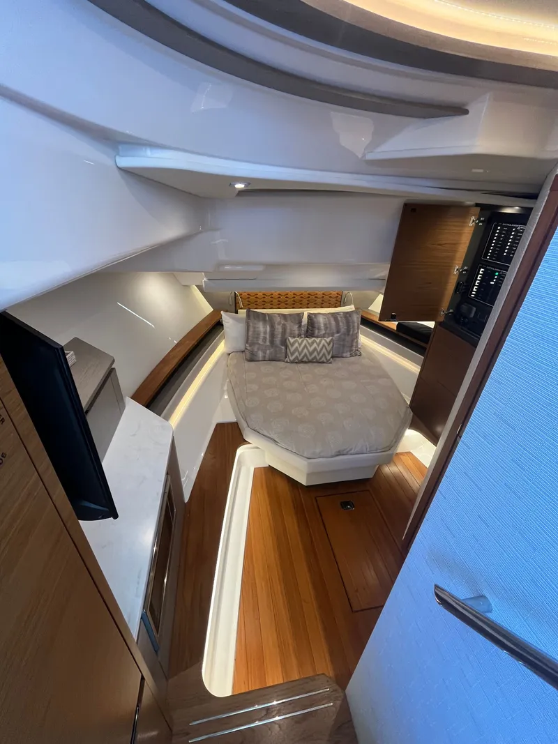 Slide: The Image of Interior of 2023 Tiara Yachts 48 LS featuring a luxurious bedroom. - 8