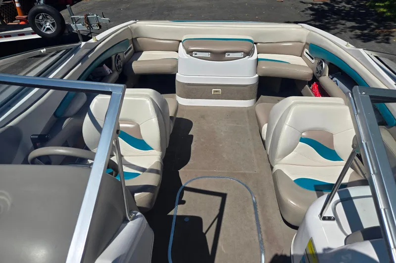 Slide: The Image of Interior of a 1996 Four Winns 200 Horizon boat with seating and steering wheel. - 8