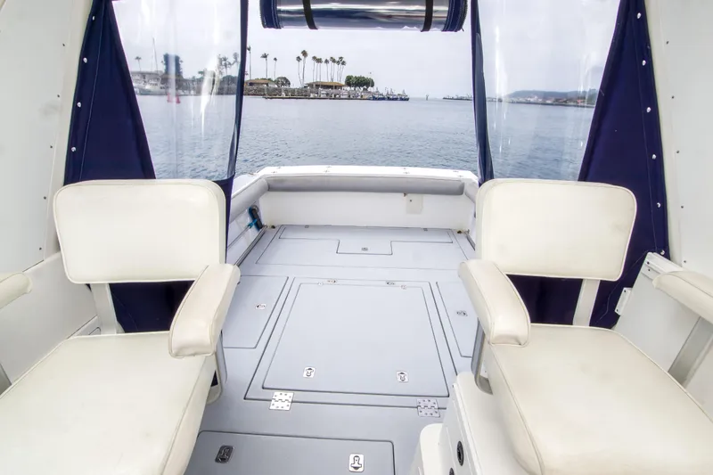 Slide: The Image of Interior view of 2006 Albin 28 Tournament Express boat with seating and ocean backdrop. - 10