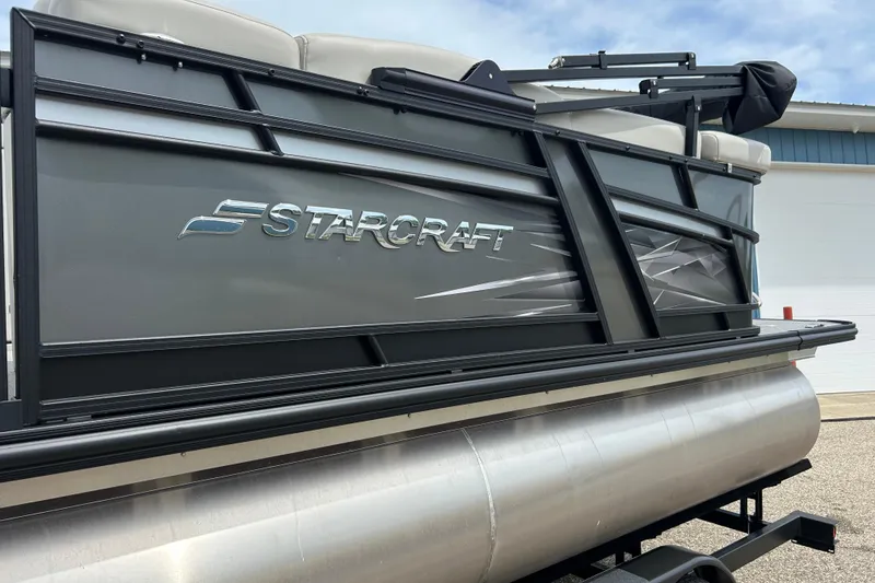 Slide: The Image of 2022 Starcraft CX 21 C pontoon boat, sleek design, side view. - 14