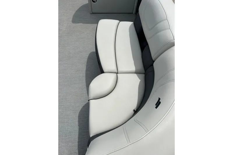 Slide: The Image of 2022 Starcraft CX 21 C boat interior with plush, curved seating. - 17