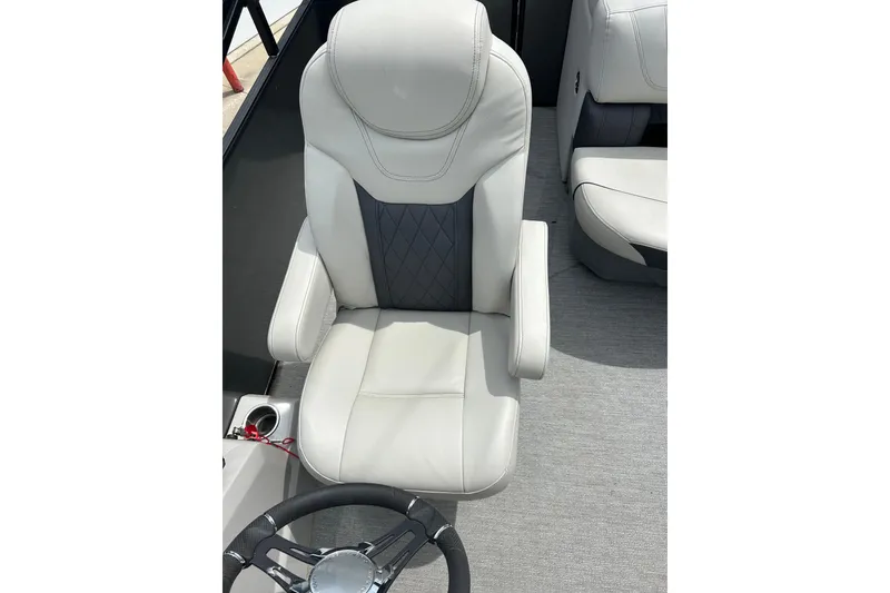 Slide: The Image of Captain's chair in 2022 Starcraft CX 21 C boat, featuring sleek design and comfortable upholstery. - 21