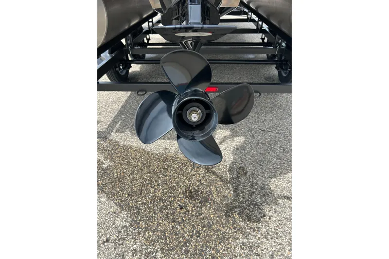 Slide: The Image of 2022 Starcraft CX 21 C boat propeller on pavement background. - 24