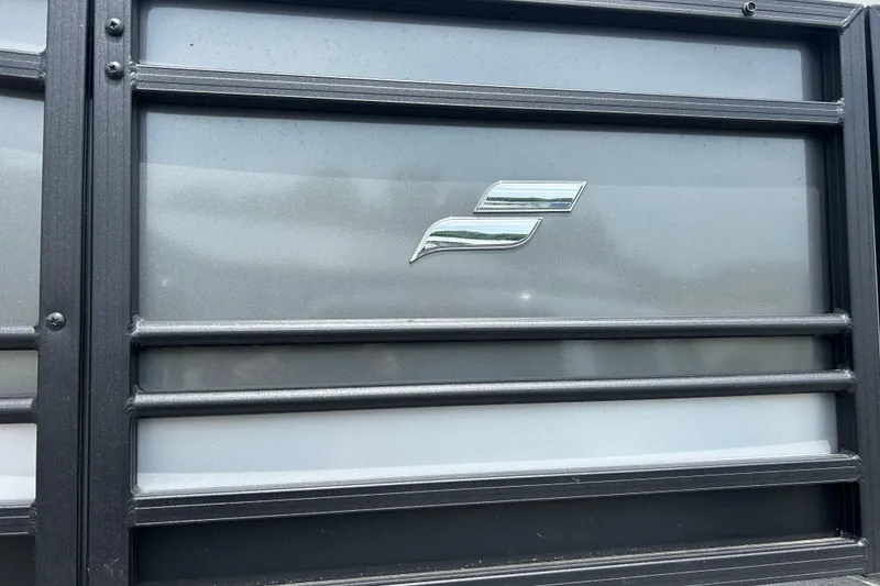 Slide: The Image of 2022 Starcraft CX 21 C logo on a metallic surface with horizontal bars. - 6