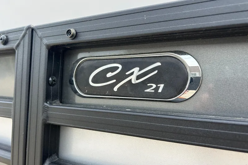 Slide: The Image of Close-up of 2022 Starcraft CX 21 C emblem on a sleek black surface. - 7