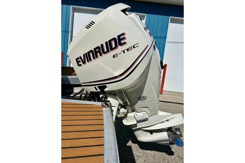 Slide: The Image of Evinrude E-TEC outboard motor on a 2012 Bennington 2250RCL boat. - 13