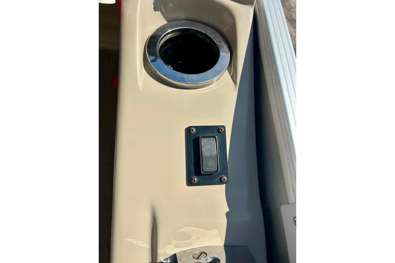 Slide: The Image of Cup holder and switch on 2012 Bennington 2250RCL boat console. - 17