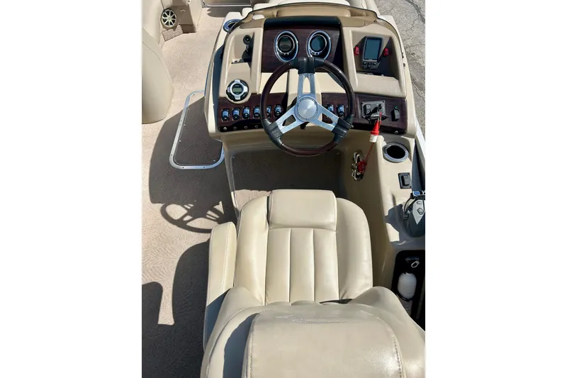 Slide: The Image of 2012 Bennington 2250RCL boat dashboard with steering wheel and control panel. - 20