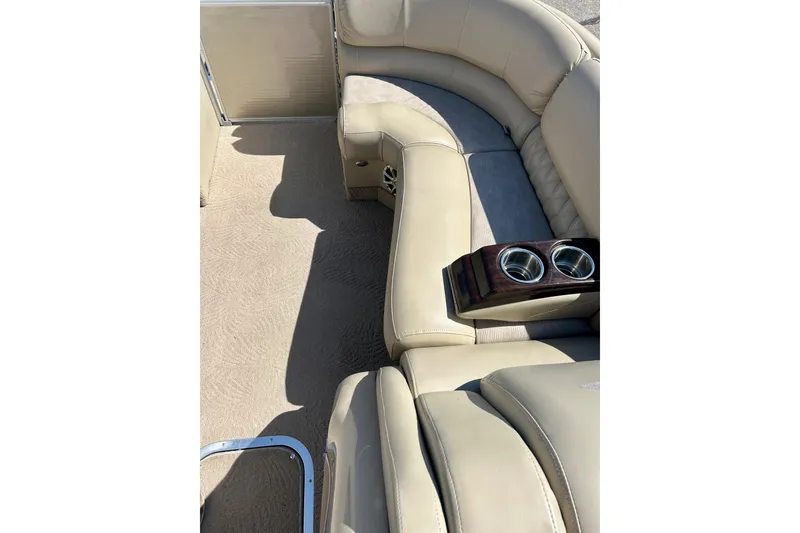 Slide: The Image of Luxurious beige seating on 2012 Bennington 2250RCL pontoon boat with cup holders. - 22