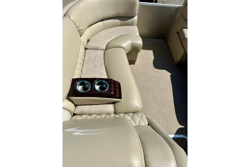 Slide: The Image of Luxurious beige seating with cup holders on a 2012 Bennington 2250RCL boat. - 27