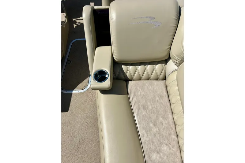 Slide: The Image of Luxurious beige seating with cup holder on 2012 Bennington 2250RCL boat. - 33