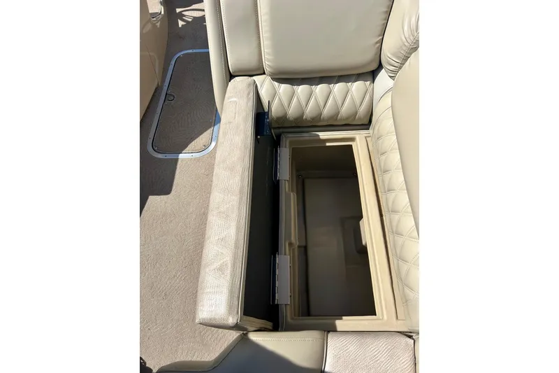 Slide: The Image of 2012 Bennington 2250RCL boat seat with open storage compartment. - 34