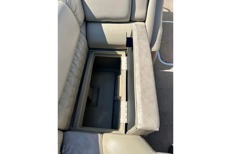 Slide: The Image of 2012 Bennington 2250RCL boat seat with open storage compartment. - 35