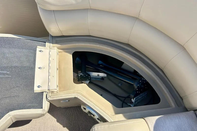 Slide: The Image of Storage compartment in a 2012 Bennington 2250RCL boat with beige upholstery. - 36