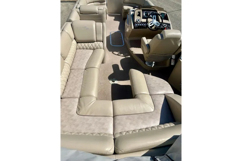 Slide: The Image of Interior of a 2012 Bennington 2250RCL pontoon boat with beige seating and helm. - 41