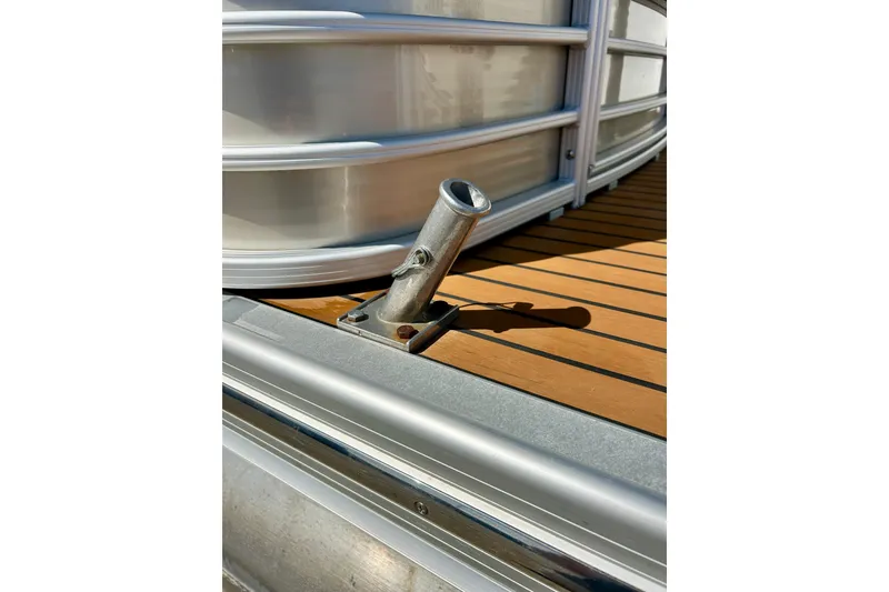 Slide: The Image of Close-up of a 2012 Bennington 2250RCL boat deck with metal fixture. - 46