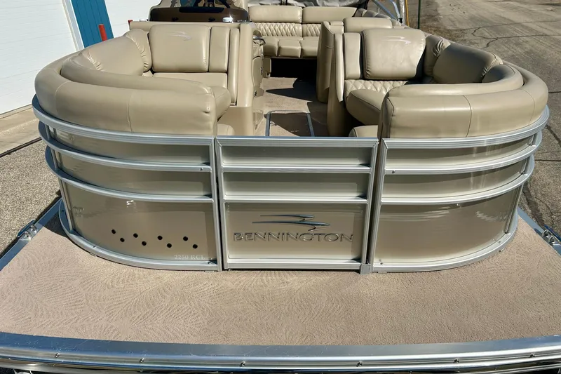 Slide: The Image of 2012 Bennington 2250RCL pontoon boat with beige seating and sleek design. - 48