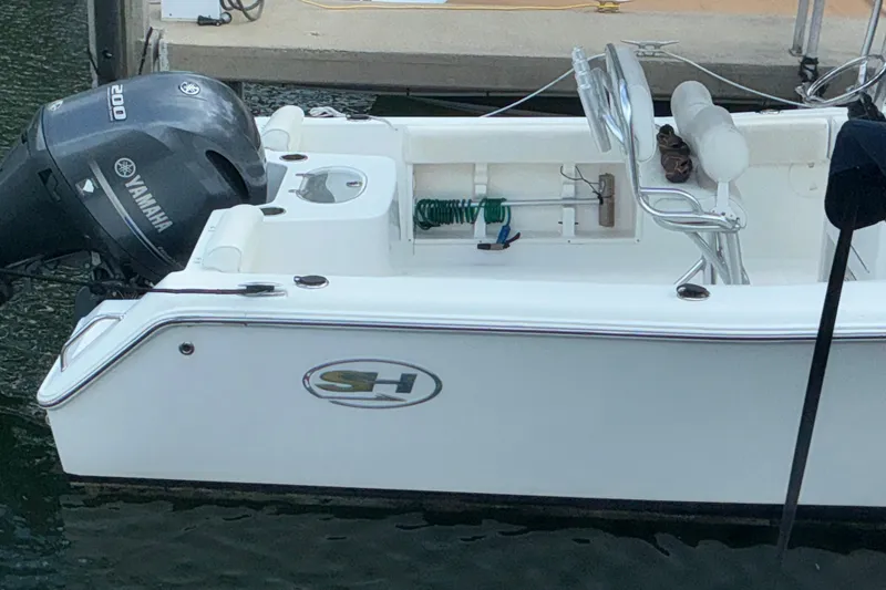 Slide: The Image of 2017 Seahunt 225 Triton boat with Yamaha engine docked at marina. - 12