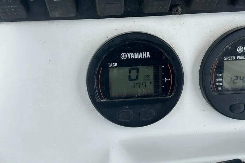 Slide: The Image of Yamaha tachometer and speed fuel gauge on 2017 Seahunt 225 Triton boat dashboard. - 15