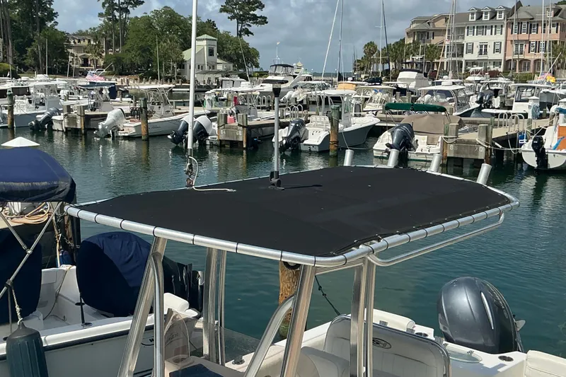 Slide: The Image of 2017 Seahunt 225 Triton boat docked in a marina with multiple boats. - 4