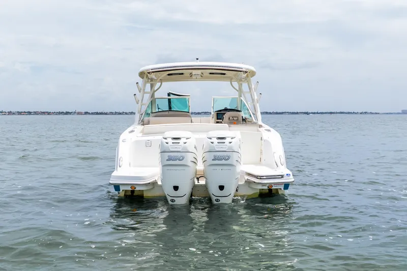 Slide: The Image of Manufacturer Provided Image: Interior of 2017 Boston Whaler 320 Vantage boat with helm and kitchenette. - 10