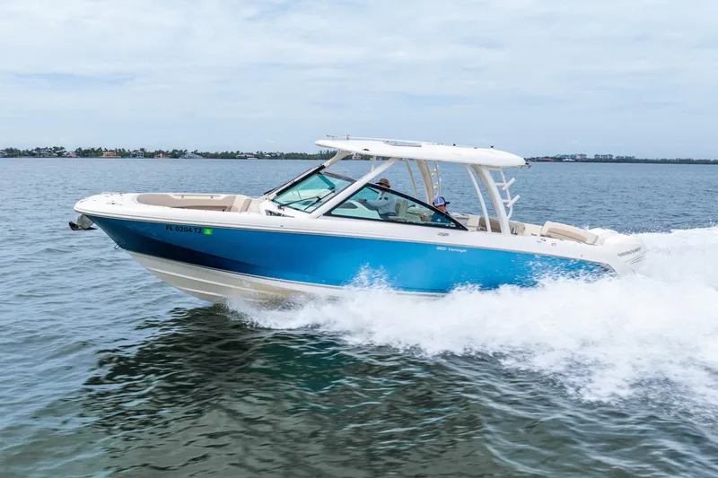 Slide: The Image of Manufacturer Provided Image: 2017 Boston Whaler 320 Vantage boat with foldable rear bench seat and twin outboard engines. - 11