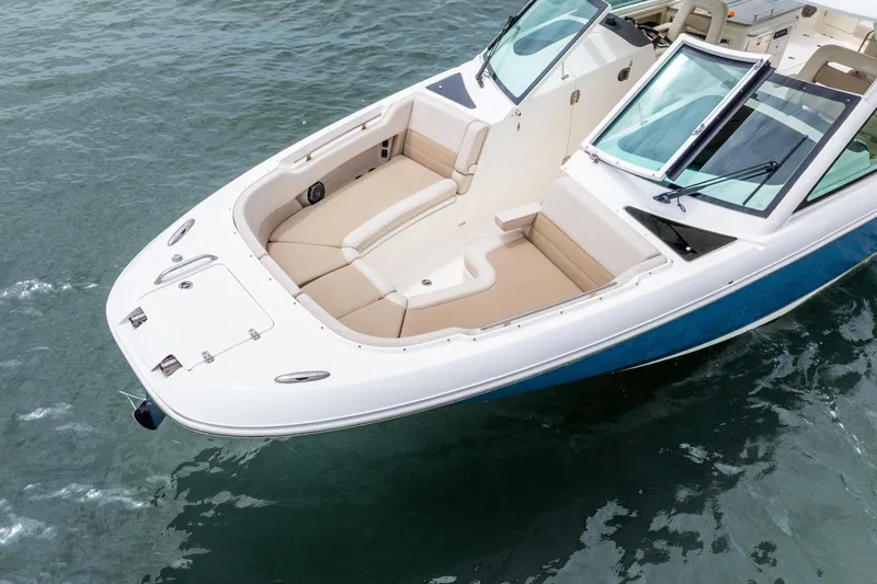 Slide: The Image of 2017 Boston Whaler 320 Vantage boat with spacious seating on calm water. - 15