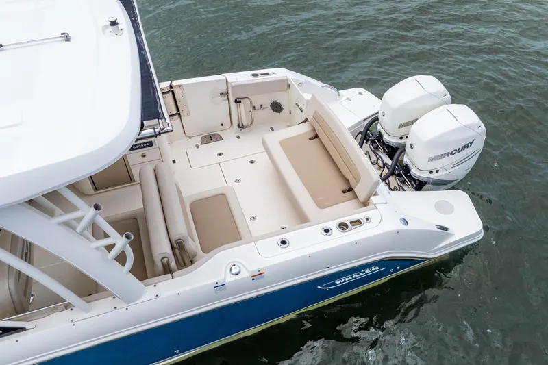 Slide: The Image of 2017 Boston Whaler 320 Vantage boat with dual Mercury engines on water. - 17