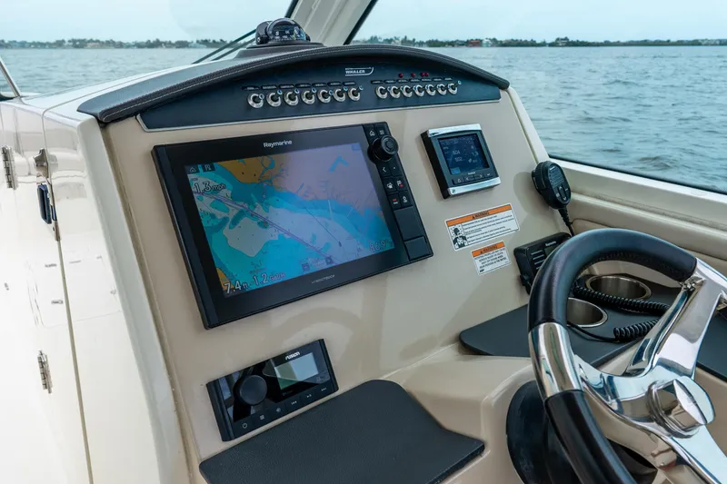 Slide: The Image of Control panel of a 2017 Boston Whaler 320 Vantage boat with navigation display. - 19