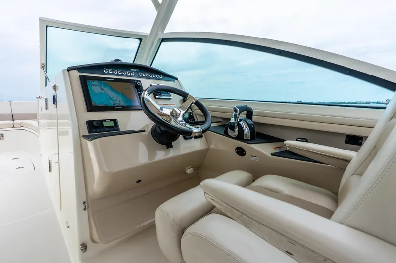 Slide: The Image of 2017 Boston Whaler 320 Vantage helm with modern controls and navigation system. - 21