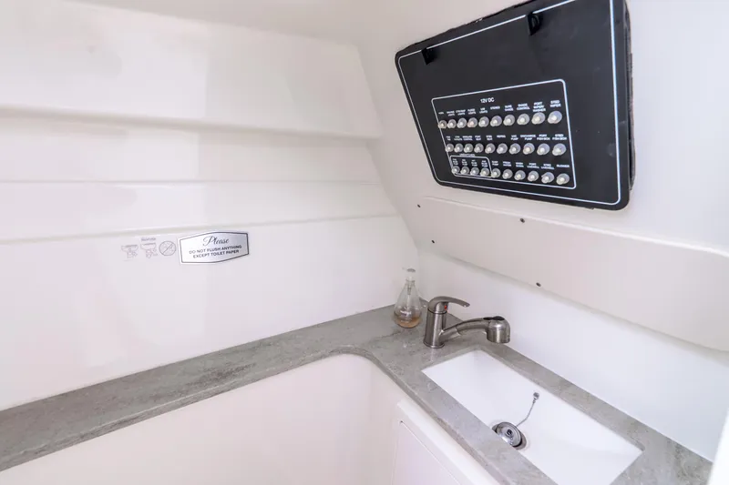 Slide: The Image of Interior of 2017 Boston Whaler 320 Vantage boat with sink and control panel. - 46