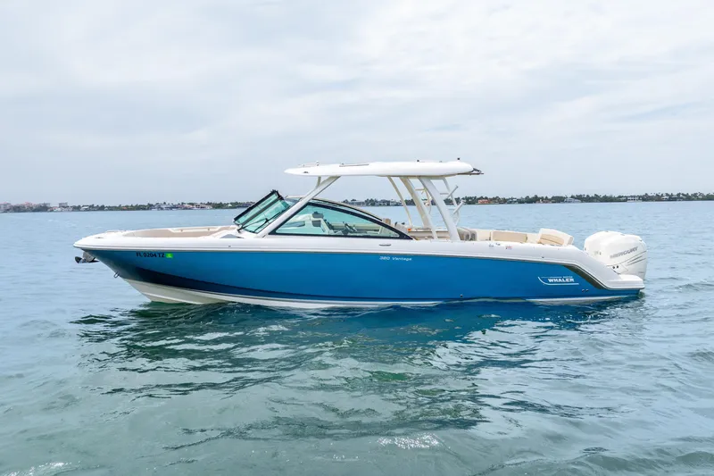 Slide: The Image of Manufacturer Provided Image: 2017 Boston Whaler 320 Vantage boat interior with cushioned seating and teak flooring. - 6