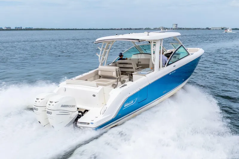Slide: The Image of Manufacturer Provided Image: Couple relaxing on a 2017 Boston Whaler 320 Vantage boat. - 7
