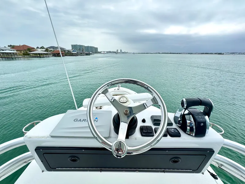 Slide: The Image of Helm of 2009 Hydra-Sports Vector 4100CC on calm waters. - 30