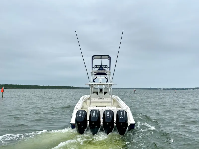 Slide: The Image of 2009 Hydra-Sports Vector 4100CC boat with four outboard engines on the water. - 8