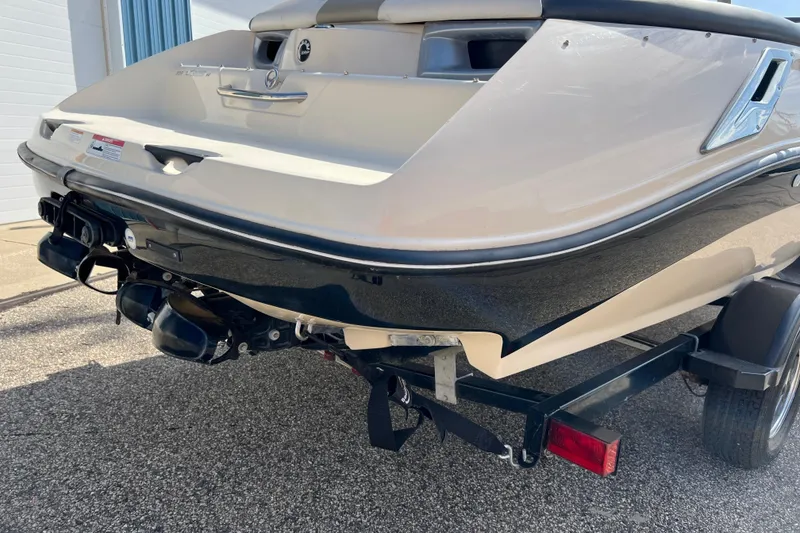 Slide: The Image of 2007 Bombardier Seadoo Utopia boat rear view on trailer, showcasing sleek design. - 3
