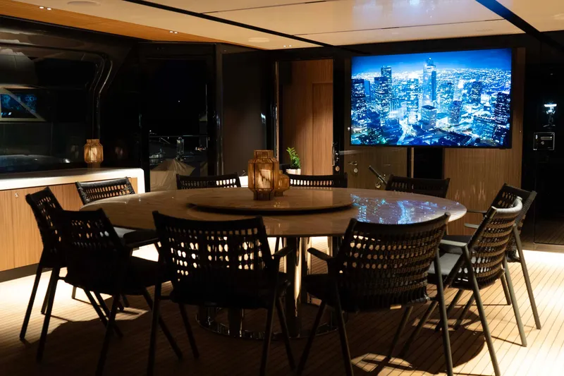 Slide: The Image of Luxurious interior of 2025 Alpha 100 Squalo Co Ownership yacht with elegant dining area. - 17