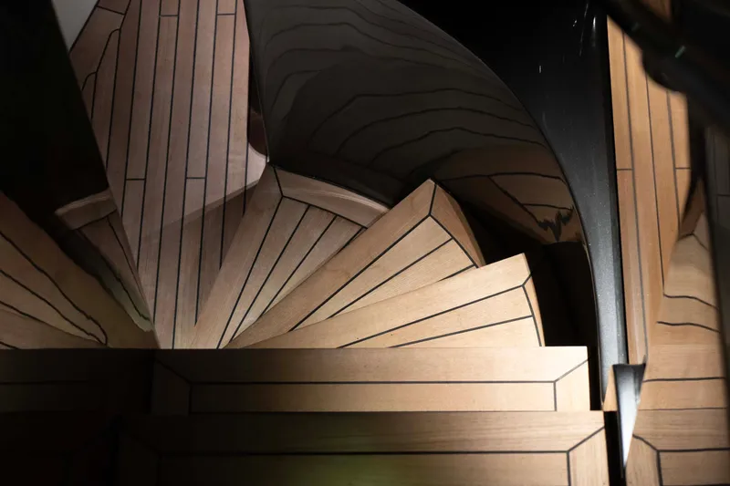 Slide: The Image of Spiral wooden staircase in 2025 Alpha 100 Squalo Co Ownership yacht. - 18