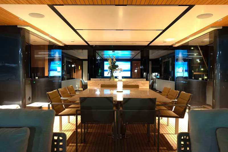 Slide: The Image of Luxurious interior of 2025 Alpha 100 Squalo Co Ownership yacht, featuring elegant dining area. - 24
