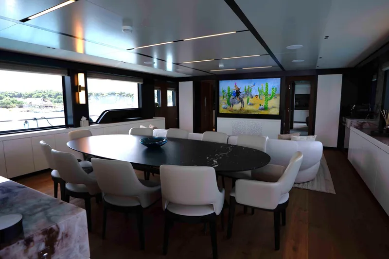 Slide: The Image of Luxurious interior of 2025 Alpha 100 Squalo Co Ownership yacht with elegant dining area. - 26