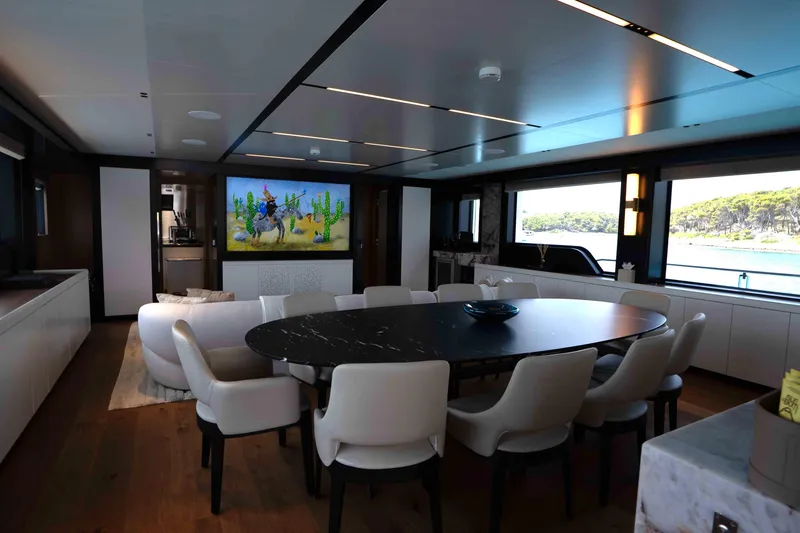 Slide: The Image of Luxurious interior of 2025 Alpha 100 Squalo Co Ownership yacht with elegant dining area. - 27