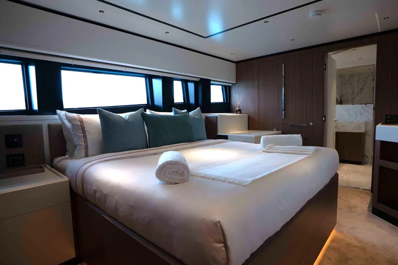 Slide: The Image of Luxurious bedroom interior of 2025 Alpha 100 Squalo Co Ownership yacht, featuring elegant design. - 30