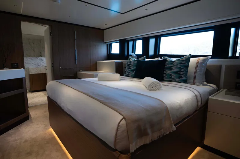 Slide: The Image of Luxurious bedroom interior of 2025 Alpha 100 Squalo Co Ownership yacht, featuring elegant design. - 31