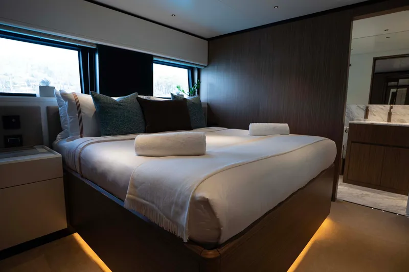 Slide: The Image of Luxurious bedroom interior of 2025 Alpha 100 Squalo Co Ownership yacht, featuring elegant design. - 33
